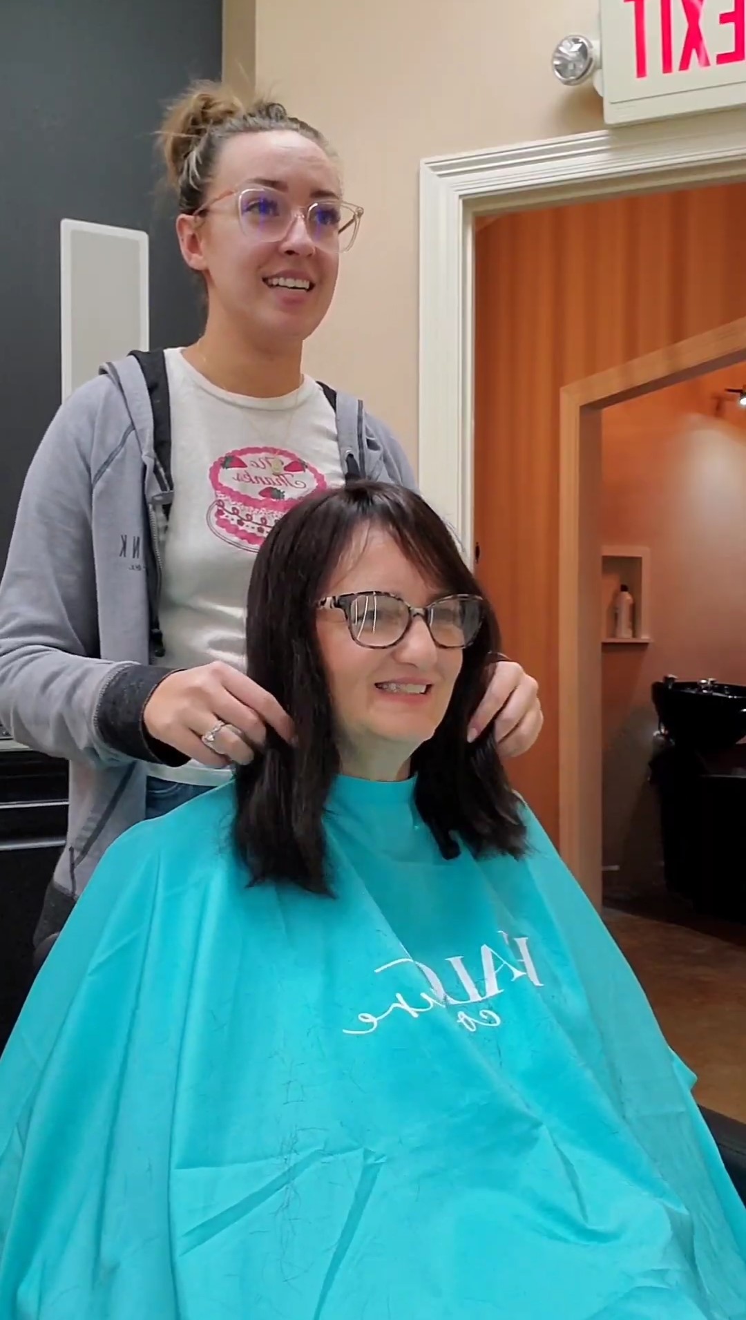 Stephanie modeling a new hair topper at Salon Bisou